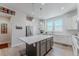 Spacious kitchen with a large center island, stainless steel appliances, and modern finishes at 2282 Old Rail Way, Superior, CO 80027