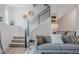 Cozy living room with modern decor, showcasing staircase and comfortable seating area at 2282 Old Rail Way, Superior, CO 80027