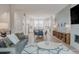 Open-concept living space flows to kitchen and dining area, complemented by modern decor at 2282 Old Rail Way, Superior, CO 80027