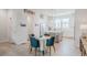 Spacious and bright open concept dining and kitchen area with modern appliances and finishes at 2282 Old Rail Way, Superior, CO 80027