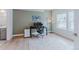 Bright office space featuring a large window, modern desk setup, plush rug, and neutral wall color at 2282 Old Rail Way, Superior, CO 80027