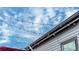 Rooftop patio features string lights, siding, and a partial view of the neighborhood at 2282 Old Rail Way, Superior, CO 80027