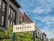 Attractive 'Downtown Superior' sign with modern condo buildings behind, showcasing a contemporary urban lifestyle at 2282 Old Rail Way, Superior, CO 80027