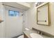 Well-lit bathroom features a shower-tub combo, vanity with solid-surface counters, and framed mirror at 11891 Gaylord Way, Northglenn, CO 80233