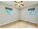 Bedroom featuring hardwood floors, neutral walls, and bright, naturally-lit windows at 11891 Gaylord Way, Northglenn, CO 80233