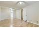 Spacious bedroom featuring wood-look floors, neutral walls, ceiling fans, and a closet for ample storage at 11891 Gaylord Way, Northglenn, CO 80233