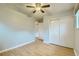 Bedroom featuring hardwood floors, closet, neutral walls, and bright, naturally-lit windows at 11891 Gaylord Way, Northglenn, CO 80233