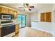 Eat-in kitchen featuring sliding doors to a spacious backyard and stainless steel appliances at 11891 Gaylord Way, Northglenn, CO 80233