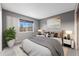 Stylish bedroom featuring an area rug, bedside tables, and views of the outdoors at 2636 Trailblazer Way, Castle Rock, CO 80109