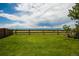 Fenced backyard with views of the mountains at 9927 Aftonwood St, Highlands Ranch, CO 80126