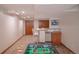 Finished basement featuring a foosball table, wet bar, and ample space at 9927 Aftonwood St, Highlands Ranch, CO 80126