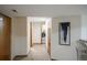 Basement hallway with tile floors, closets, and access to laundry area at 9927 Aftonwood St, Highlands Ranch, CO 80126