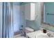 Cozy bathroom featuring a shower with a bathtub, toilet, vanity with mirror and cabinet at 9927 Aftonwood St, Highlands Ranch, CO 80126