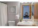 A well-lit bathroom features modern fixtures and a vanity, providing a clean and functional space at 9927 Aftonwood St, Highlands Ranch, CO 80126