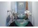 Stylish bathroom with a vessel sink, modern faucet, and decorative accents at 9927 Aftonwood St, Highlands Ranch, CO 80126
