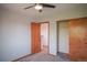 Carpeted bedroom features neutral walls and closet with sliding doors at 9927 Aftonwood St, Highlands Ranch, CO 80126