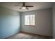 Bright bedroom features a ceiling fan and a window offering natural light at 9927 Aftonwood St, Highlands Ranch, CO 80126