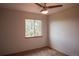 A cozy bedroom featuring a window that offers natural light and tree views for a serene retreat at 9927 Aftonwood St, Highlands Ranch, CO 80126