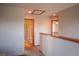 A hallway features a bathroom view with a shower and toilet, enhancing accessibility and convenience at 9927 Aftonwood St, Highlands Ranch, CO 80126