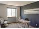 Home office featuring a modern desk, comfortable seating, and a bright window for natural light at 9927 Aftonwood St, Highlands Ranch, CO 80126