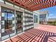 Red wood deck with a pergola, a sliding glass door, and a view of the backyard at 1674 Bent Grass Cir, Castle Rock, CO 80109
