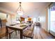 Open floorplan dining room leads to living room with fireplace and sliding door access to deck at 1674 Bent Grass Cir, Castle Rock, CO 80109