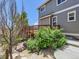 Exterior of a gray home, showcasing the yard and a two-story deck at 1674 Bent Grass Cir, Castle Rock, CO 80109