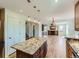 Spacious open floor plan showcasing the kitchen, living room, and stairs to the second floor at 1674 Bent Grass Cir, Castle Rock, CO 80109