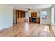Cozy living room with hardwood floors, a brick fireplace, built-in bookshelves and lots of natural light at 1674 Bent Grass Cir, Castle Rock, CO 80109