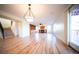 Bright living room featuring hardwood floors, a fireplace, built-in bookshelves and sliding door access to deck at 1674 Bent Grass Cir, Castle Rock, CO 80109