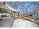 Large covered patio and spacious backyard with mature trees at 3000 S Jackson St, Denver, CO 80210
