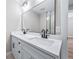 This bathroom features double vanity sinks, with matte black fixtures, and a large mirror at 3000 S Jackson St, Denver, CO 80210