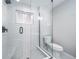 Modern bathroom features glass shower, white subway tile and matte black fixtures at 3000 S Jackson St, Denver, CO 80210