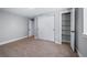 Neutral bedroom featuring carpet, closet, and doors at 3000 S Jackson St, Denver, CO 80210