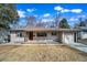 Charming single-story home featuring a well-maintained lawn, inviting entrance, and an attached one car garage at 3000 S Jackson St, Denver, CO 80210