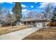Charming single-story home featuring a well-maintained driveway, inviting entrance, and an attached one car garage at 3000 S Jackson St, Denver, CO 80210