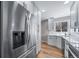 A sleek, updated kitchen featuring stainless steel appliances and white cabinetry at 3000 S Jackson St, Denver, CO 80210