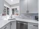 A kitchen with white cabinets, stainless steel appliances and quartz countertops at 3000 S Jackson St, Denver, CO 80210