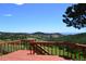 Breathtaking view from this wooden deck, perfect for outdoor entertaining and relaxation at 21849 Cabrini Blvd, Golden, CO 80401