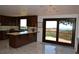 Modern kitchen with stainless steel appliances, stylish backsplash, and access to the outdoor deck at 21849 Cabrini Blvd, Golden, CO 80401