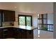 Well-equipped kitchen with modern appliances, a stylish backsplash, and stunning views at 21849 Cabrini Blvd, Golden, CO 80401