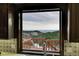 Close-up of a sink with a fantastic mountain view from the kitchen window at 21849 Cabrini Blvd, Golden, CO 80401