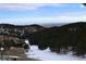 Scenic mountain landscape with snow and a distant city view at 21849 Cabrini Blvd, Golden, CO 80401