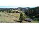 Scenic hillside landscape with lush green trees and an abundance of natural beauty at 21849 Cabrini Blvd, Golden, CO 80401