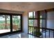Modern living room with large windows, a balcony, and beautiful views, offering a bright and airy atmosphere at 21849 Cabrini Blvd, Golden, CO 80401