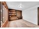 Office with built-in wooden shelves and cabinets, offering ample storage space and natural light at 21849 Cabrini Blvd, Golden, CO 80401