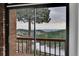 Expansive mountain and valley view from a private deck with wood railings at 21849 Cabrini Blvd, Golden, CO 80401
