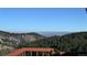 Breathtaking distant city view overlooking lush trees and beautiful rolling hills at 21849 Cabrini Blvd, Golden, CO 80401