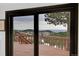 Stunning mountain views through the sliding glass doors leading to a private balcony at 21849 Cabrini Blvd, Golden, CO 80401