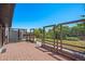 Spacious back deck with wood flooring and fenced perimeter overlooking trees at 9350 Raleigh Ct, Westminster, CO 80031